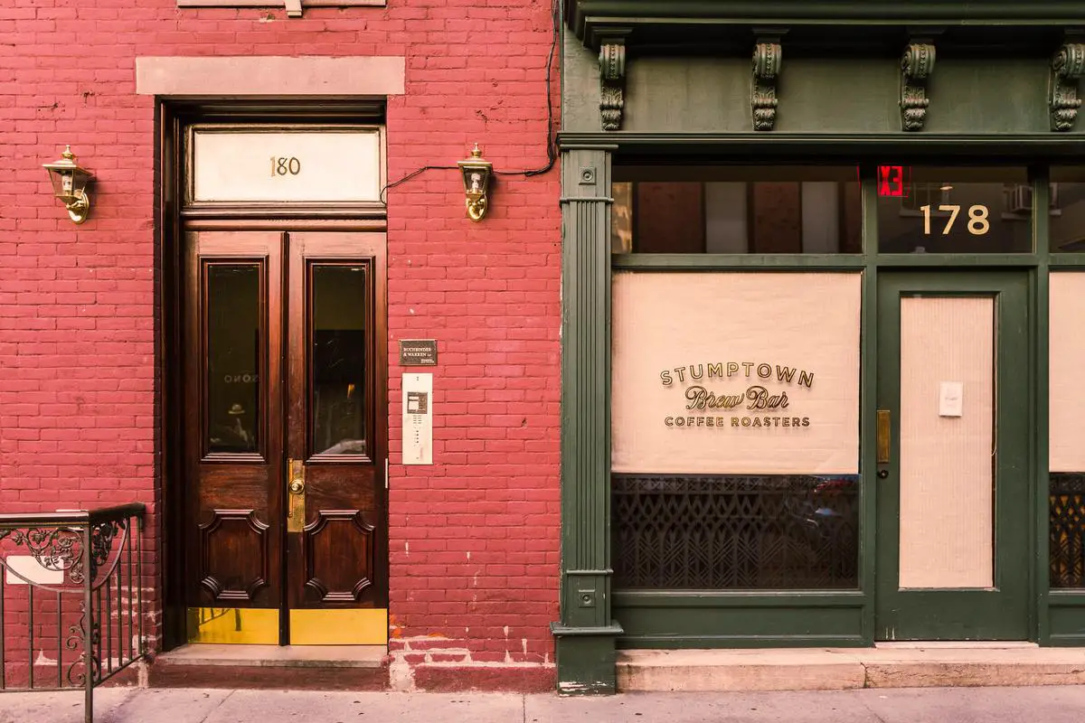 A visual representation of physical evidence in the service sector: a clean and well-designed storefront with staff wearing professional uniforms, showcasing branding efforts.