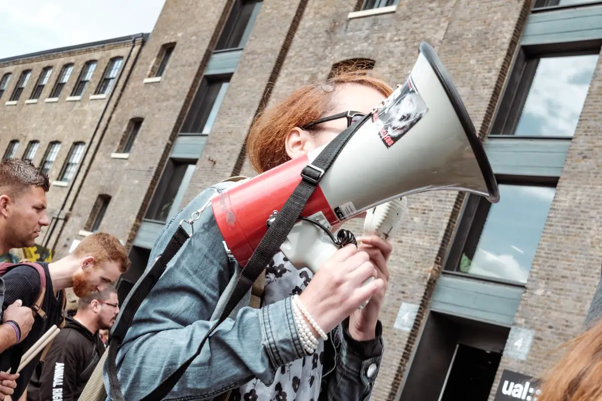 An image showing a person with a megaphone spreading information to symbolize publicity in marketing.
