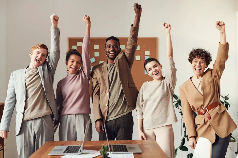 A group of diverse people holding hands, symbolizing unity and success achieved through marketing strategies built on consumer attitudes and beliefs.